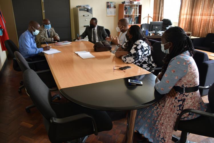 Prof. Afe Adogame  in discussion with the Associate Dean, Chair of Department and the project team