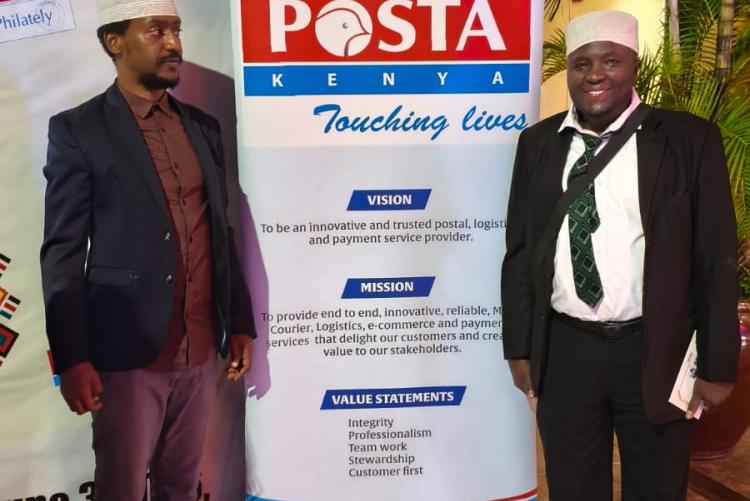 Dr Hassan Kinyua Omari posing  a photo  